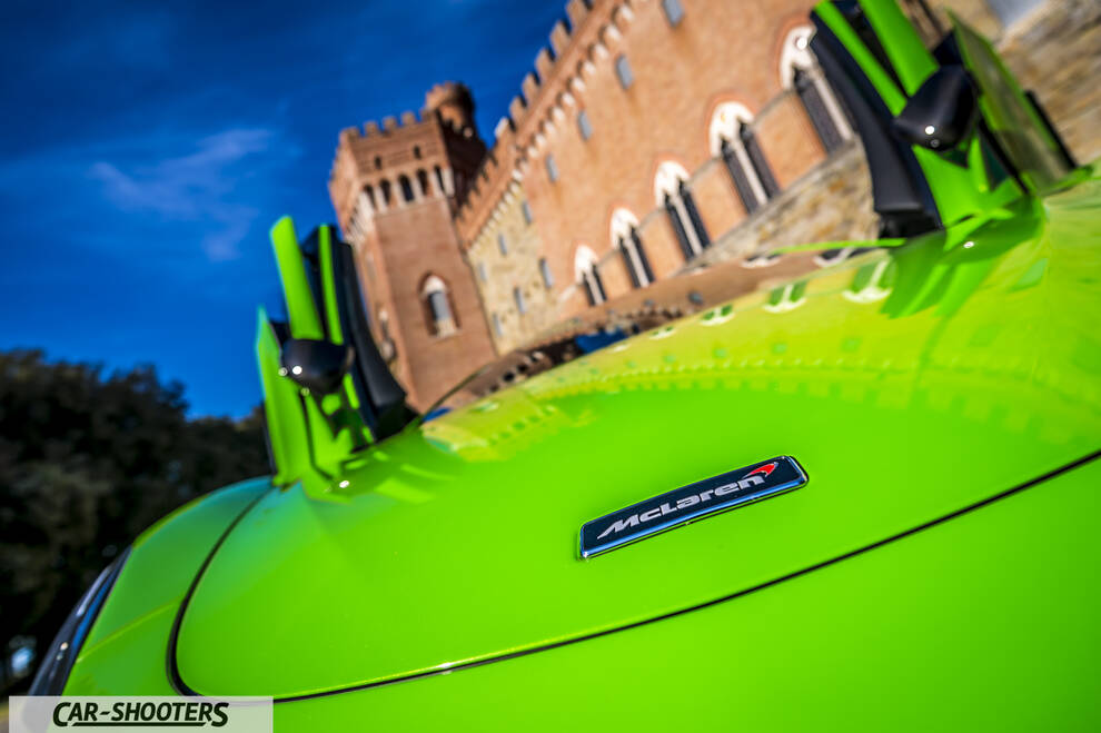 Mclaren 570S – front three-quarter, bright green against a castle backdrop