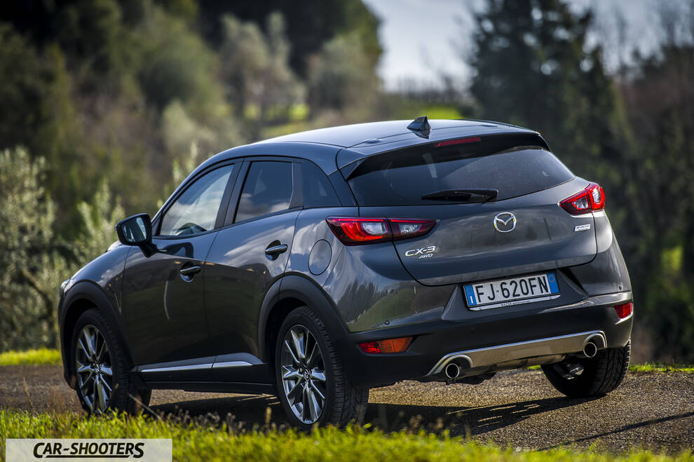 Mazda CX 3 – rear three-quarter, grey metallic on a country road