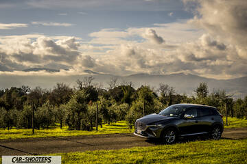Mazda CX 3 – front three-quarter, dark grey metallic against a mountain backdrop