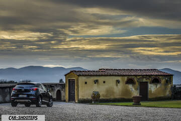 Mazda CX 3 – rear three-quarter, dark grey against a dramatic sky