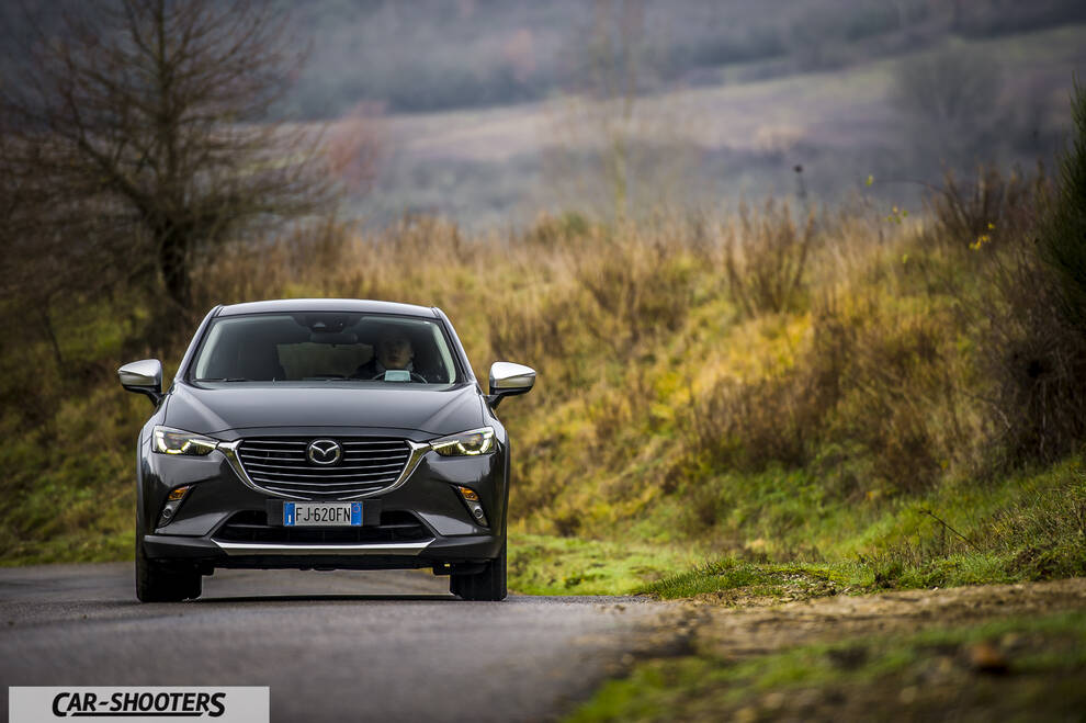 Mazda CX 3 – front three-quarter, dark grey metallic on a country road