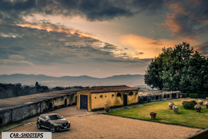 Mazda CX 3 – front three-quarter, dark grey against a dramatic sunset backdrop