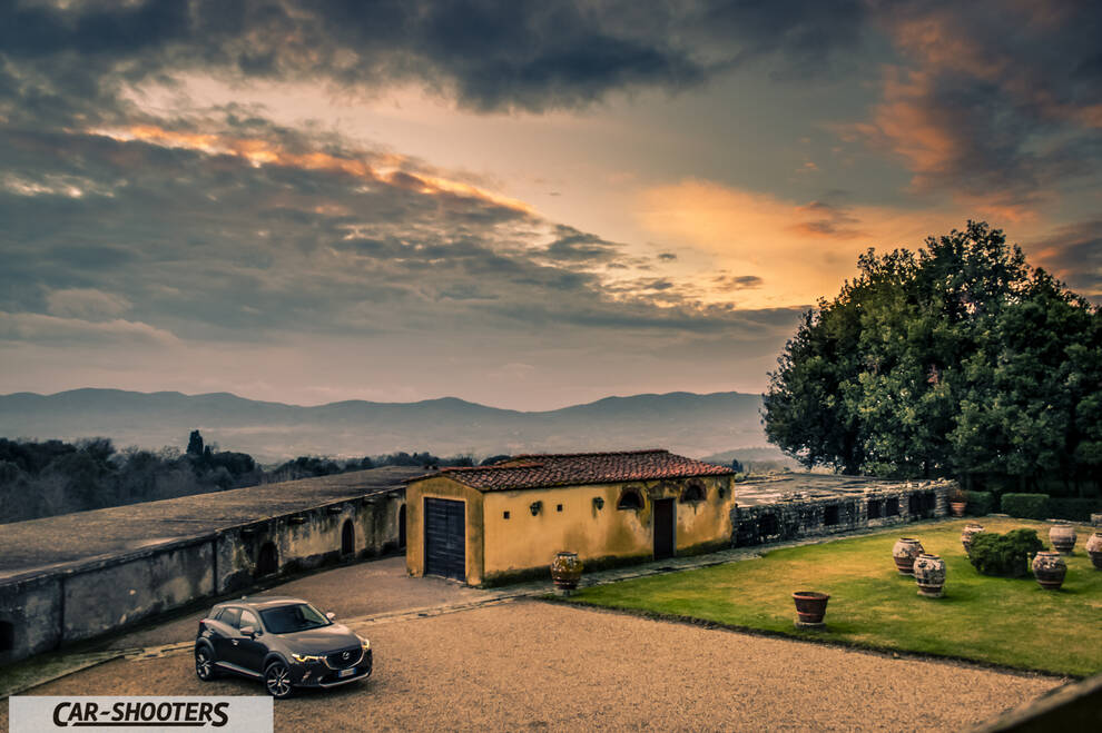 Mazda CX 3 – front three-quarter, dark grey against a dramatic sunset backdrop