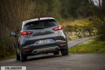Mazda CX 3 – rear three-quarter, grey metallic on a country road