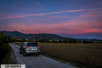 Volkswagen Tiguan – rear view, silver on a country road