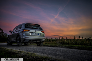 Volkswagen Tiguan – rear three-quarter, silver on a road at sunset