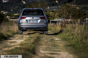 Volkswagen Tiguan – rear view, silver metallic on a country road