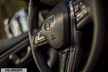 Infiniti Q50 – interior, leather steering wheel close up
