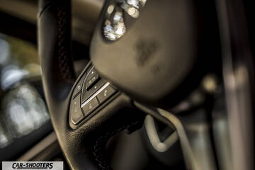 Infiniti Q50 – interior, steering wheel controls close-up