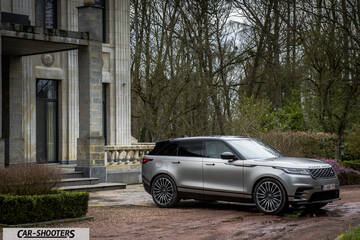 front three-quarter, silver parked near a historic building