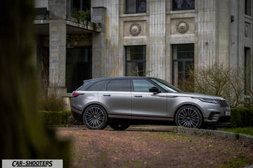 side profile, silver parked in front of old building