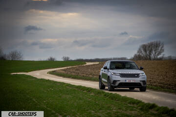 front three-quarter, silver metallic on a country road