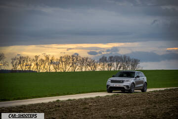 Rover – front three-quarter, silver metallic on a country road