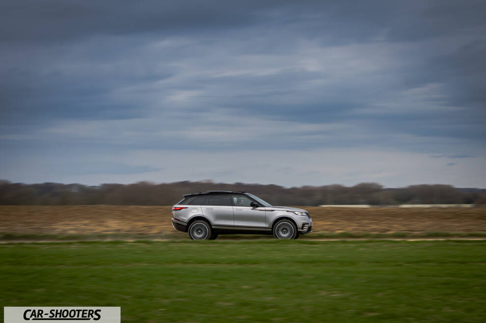 side profile, silver driving across a grassy field