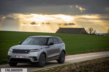 front three-quarter, silver metallic on a country road