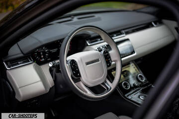 dashboard, modern steering wheel and dual touchscreens