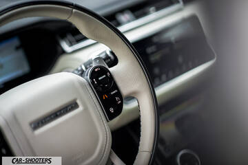 dashboard, leather steering wheel close-up