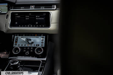 dashboard, with dual touchscreens and rotary dial