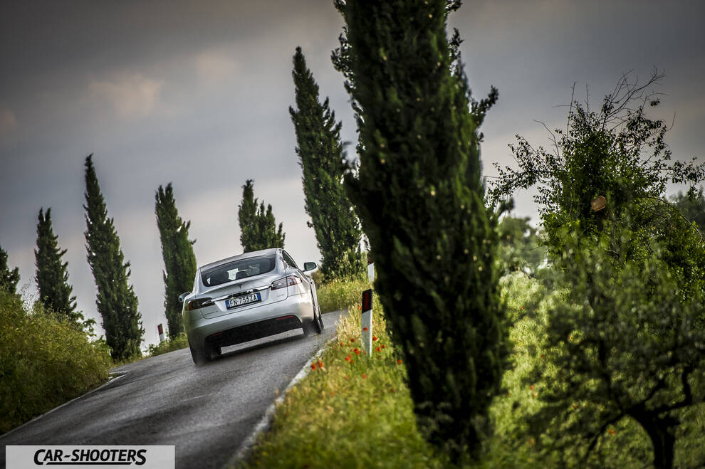 Tesla Model S – rear view, silver on a country road
