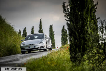 Tesla Model S – front three-quarter, silver on a country road