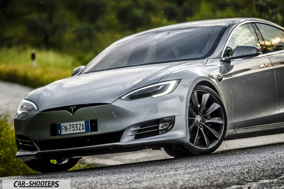 Tesla Model S – front three-quarter, silver metallic on a country road