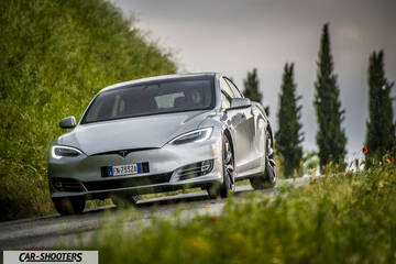 Tesla Model S – front three-quarter, silver metallic on a country road