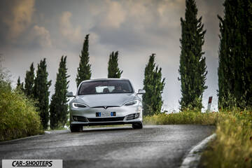 Tesla Model S – front three-quarter, silver on a country road