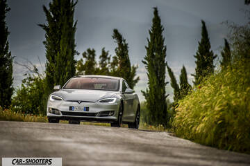Tesla Model S – front three-quarter, silver on a country road