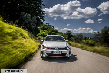 Volkswagen Golf GTI – front three-quarter, silver on a country road