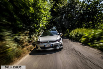 Volkswagen Golf GTI – front three-quarter, silver on a country road