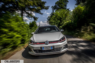 Volkswagen Golf GTI – front three-quarter, silver on a country road