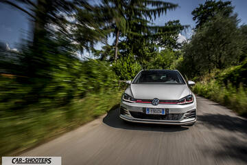 Volkswagen Golf GTI – front three-quarter, silver on a country road