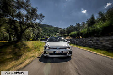 Volkswagen Golf GTI – front three-quarter, white on a country road
