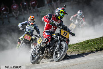front three-quarter, black racing on dirt track