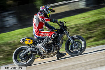 side profile, black on a track with motion blur