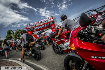 front three-quarter, red at a motorcycle event