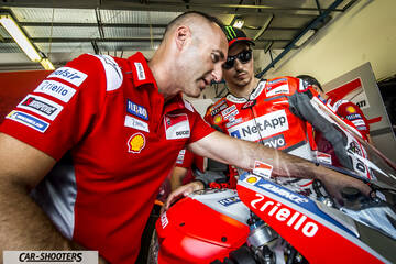 detail, mechanics working on motorcycle
