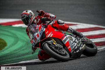 front three-quarter, red on a race track