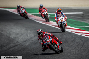 front three-quarter, red on a race track