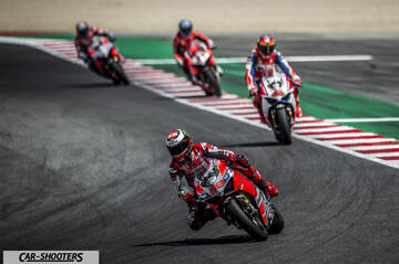 front three-quarter, red on a race track
