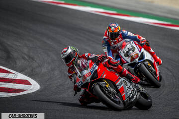 front three-quarter, red on a race track