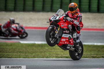 front three-quarter, red on a race track