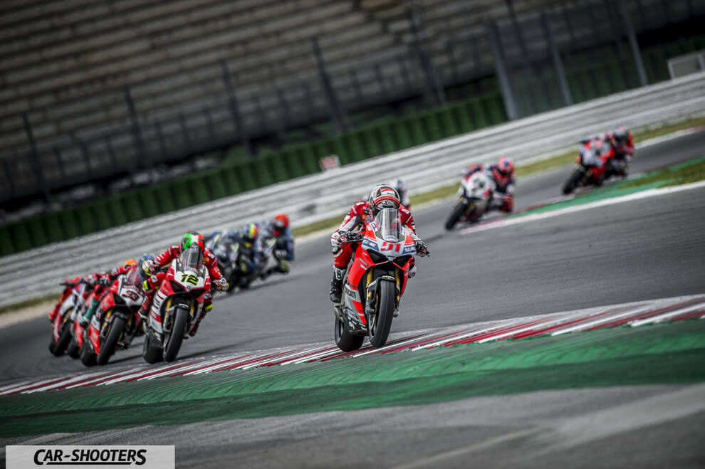front three-quarter, red on a race track