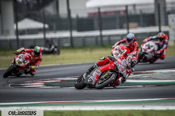 front three-quarter, red on a race track