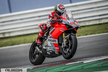 front three-quarter, red on a race track