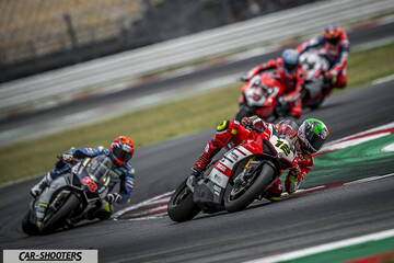 front three-quarter, red and white on a race track