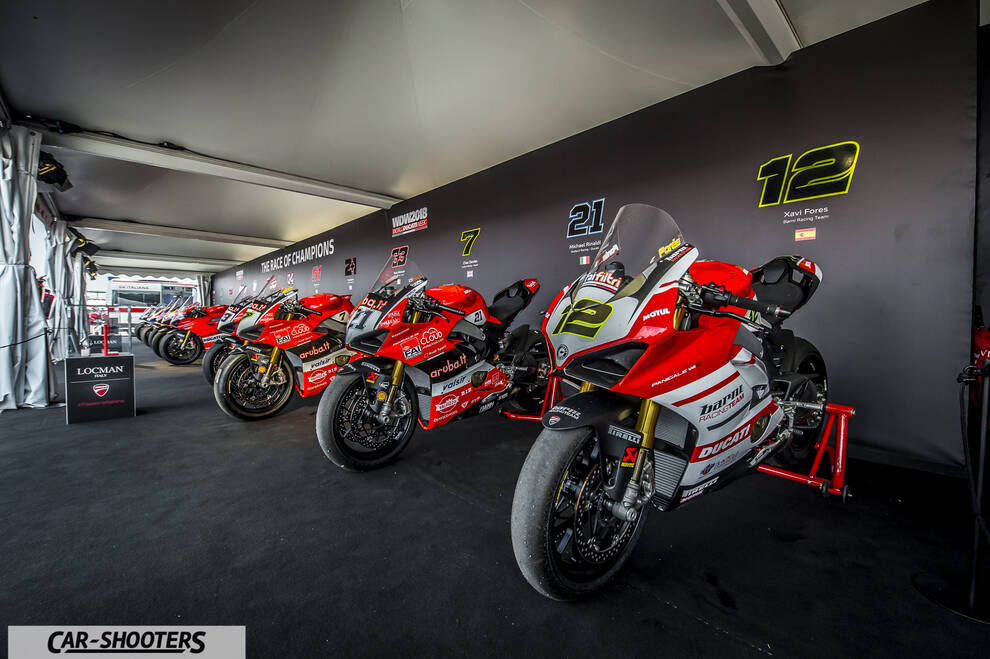 front three-quarter, red in a pit garage
