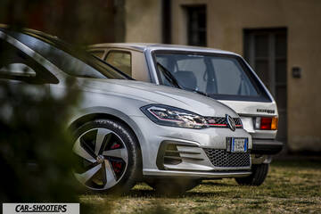 front three-quarter, silver parked outdoors on grass