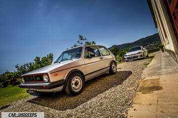 front three-quarter, silver on a gravel driveway