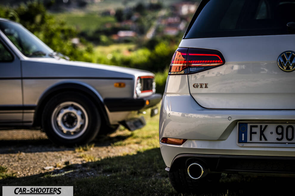 rear view, white parked on grass outdoors